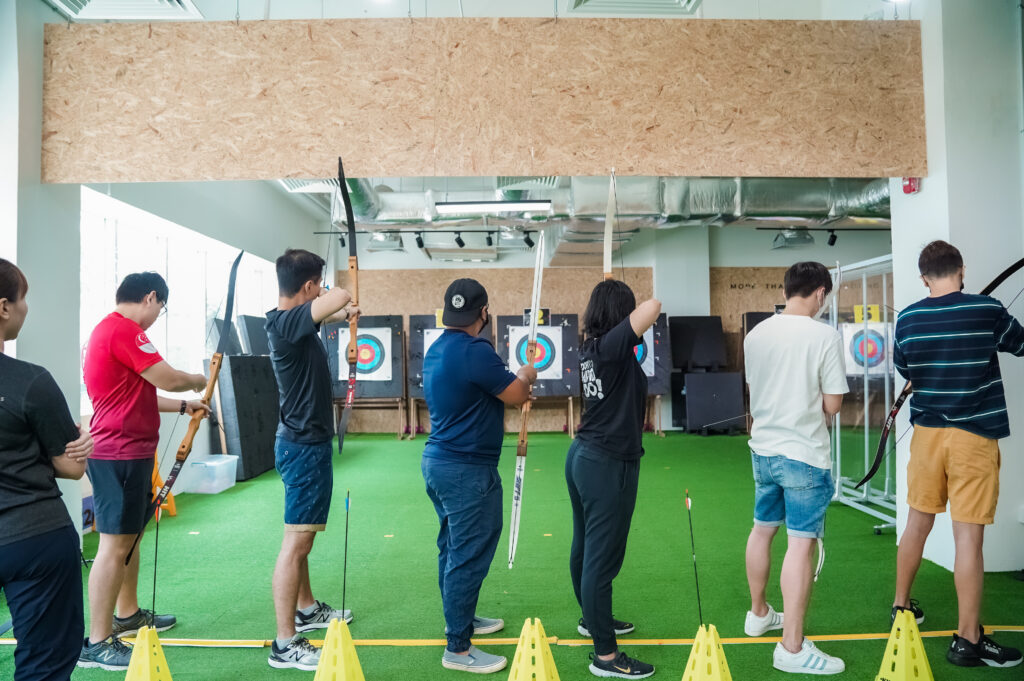 SIT Alumni put their game faces on and focus for the perfect shot.